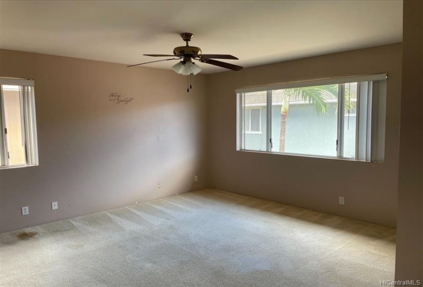 Primary bedroom with plenty of natural light.