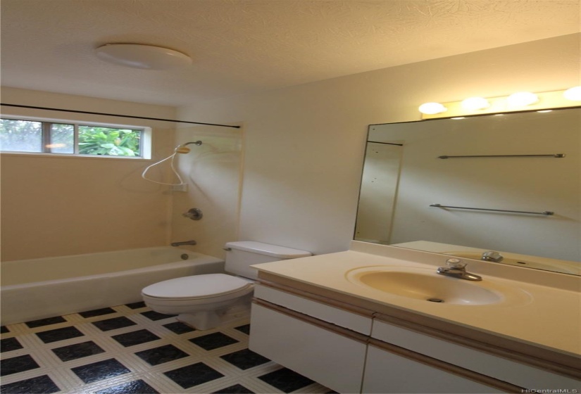 Two downstairs bedrooms have private bathrooms