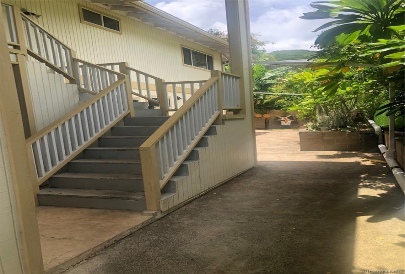 These stairs lead to the covered deck and 2BR upstairs space.