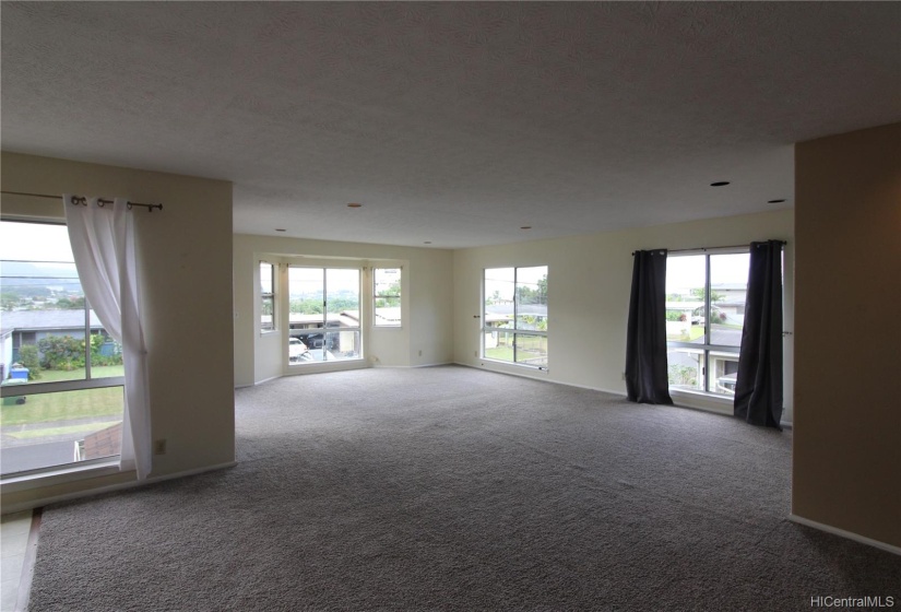 This spacious living room upstairs has nice views.