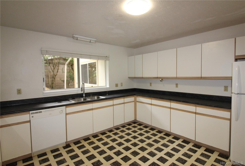 Large kitchen window lets in the light.