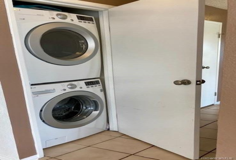 A full sized washer and dryer are located off the hall