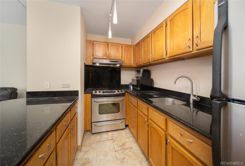 This unit features an updated kitchen with granite counters, roomy kitchen cabinets & stainless steel appliances.