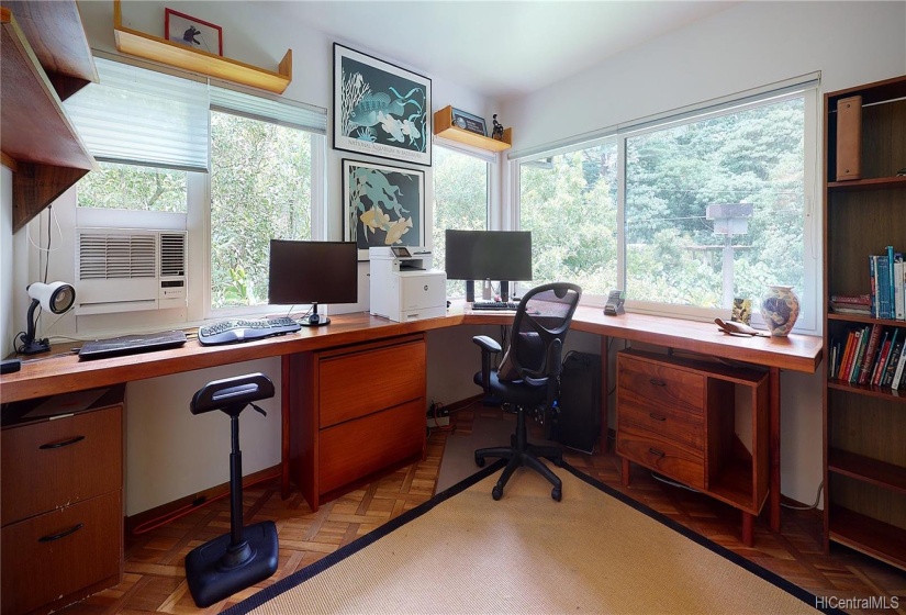 This second floor Bedroom currently being used as an Office features wood inlaid flooring, Window AC and Mountain Views. Large walled Closet is to the right of photo (not shown).