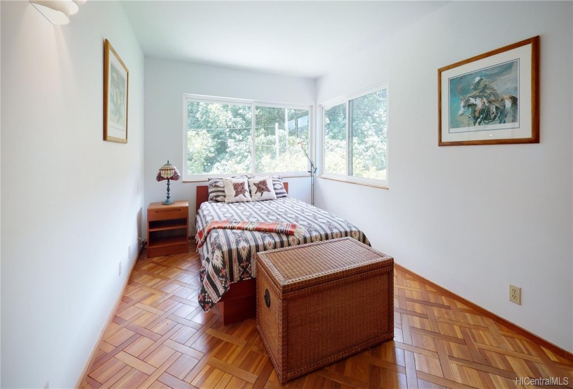 Another Bedroom on the second floor featuring wood inlaid flooring and sliding windows.(Large wall Closet not shown).