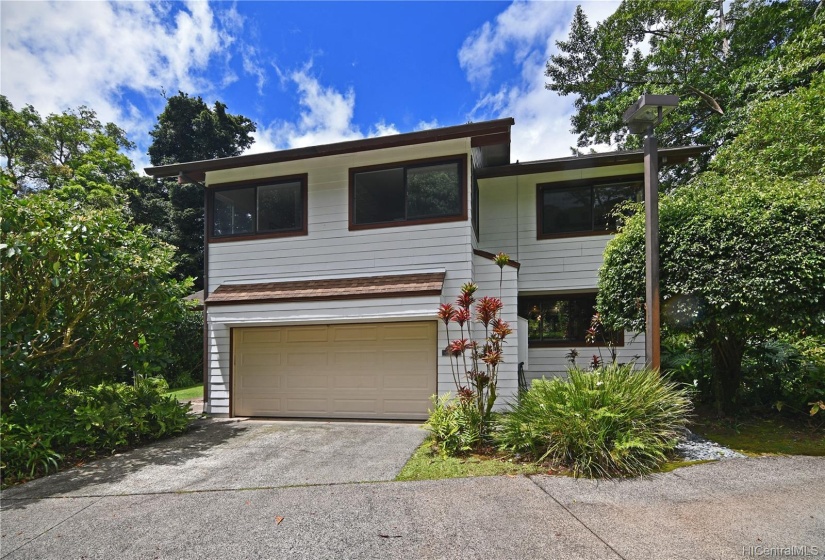 The home features a large 2 car garage with storage closet. Existing Shelving can stay or leave (not shown).