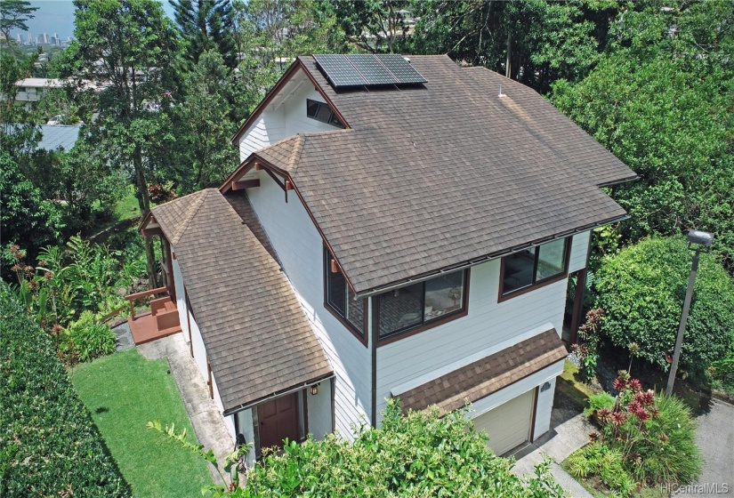 The 4 bedroom Home features 3 levels. Peaceful Waihi Stream runs along the right side and back of Home.