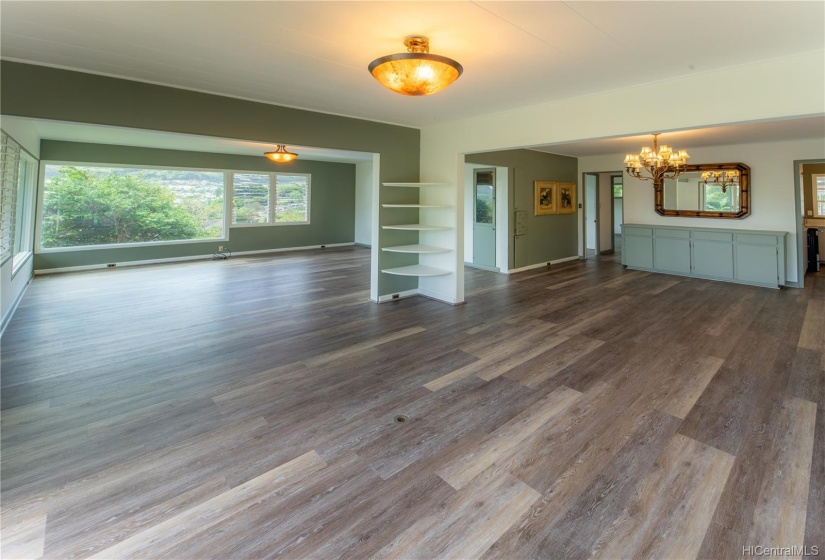 Spacious, open, and airy living, dining room.