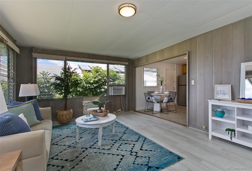 Living Room opens to the kitchen with large windows and wonderful light.