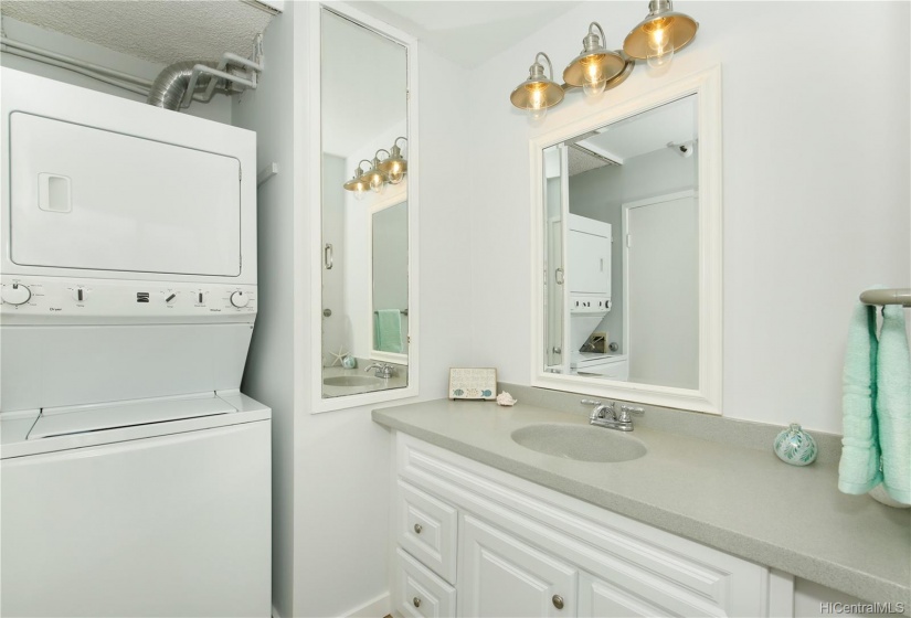 Vanity area of the bathroom w/ WD.