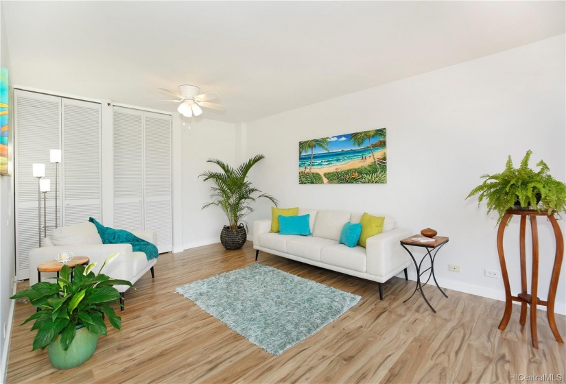 Great living area w/ storage cabinets & waterproof wood-like laminated flooring.