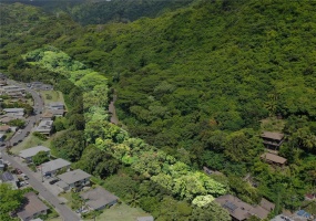 Wow! 2.92 acres of tropical oasis fronting Lai Rd.