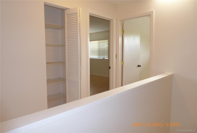 Looking at master bedroom from stair well. Door on right is 4th bedroom, added when renovated.