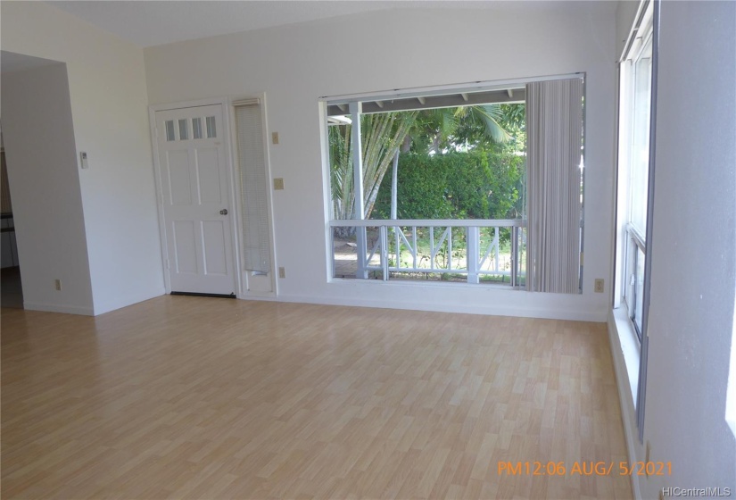 Living room, looking out side entry.