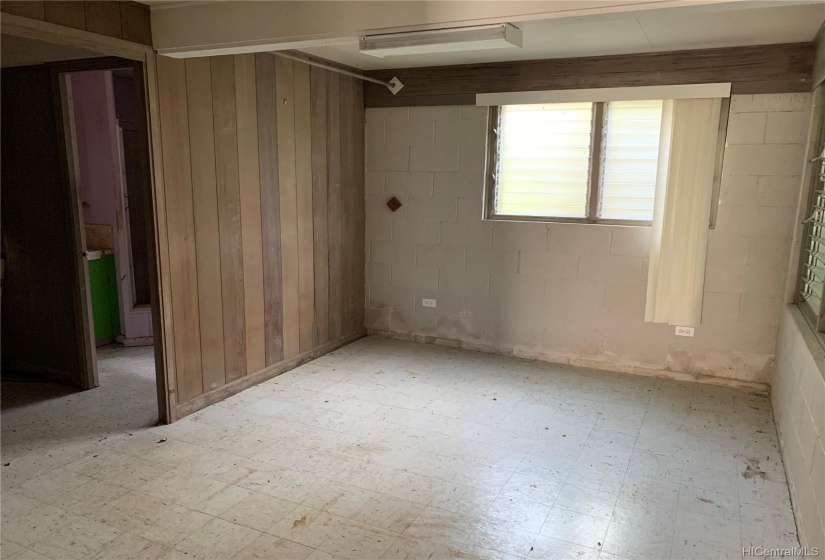 Downstairs room with entry to bath and laundry