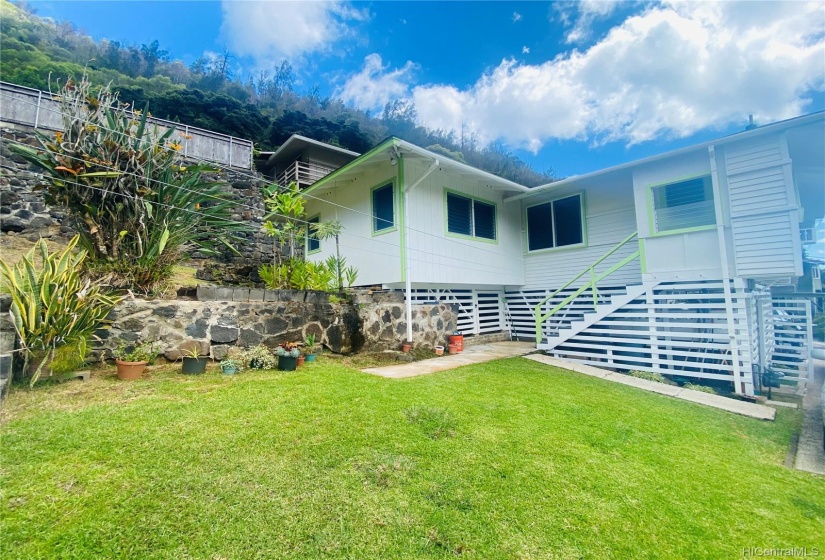 Back of home, stairs leading to kitchen