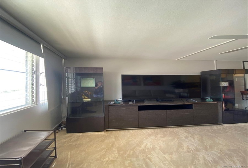 The Italian entertainment center offers lots of storage and the flat screen TV is included.