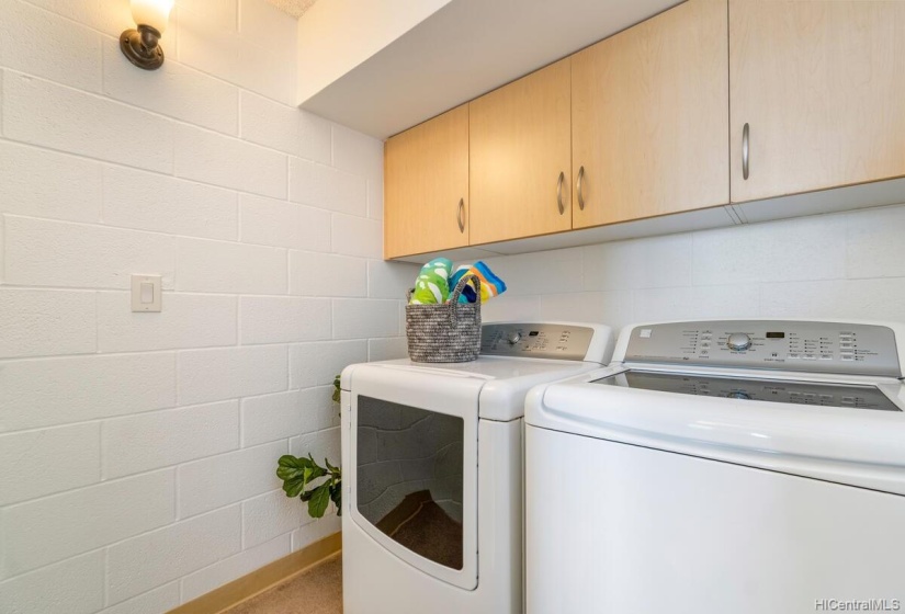 Washer and dryer are located at the top of the stairs.