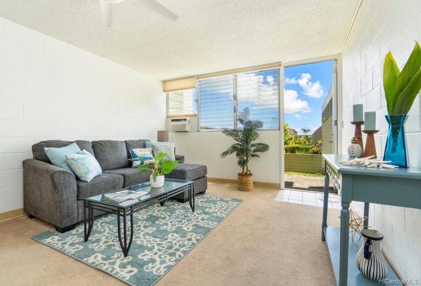 Living room which leads out to the lanai and yard.