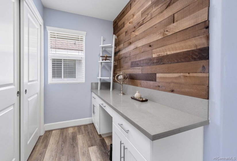 Upstairs work station by landing. Notice the beautiful wood decor!