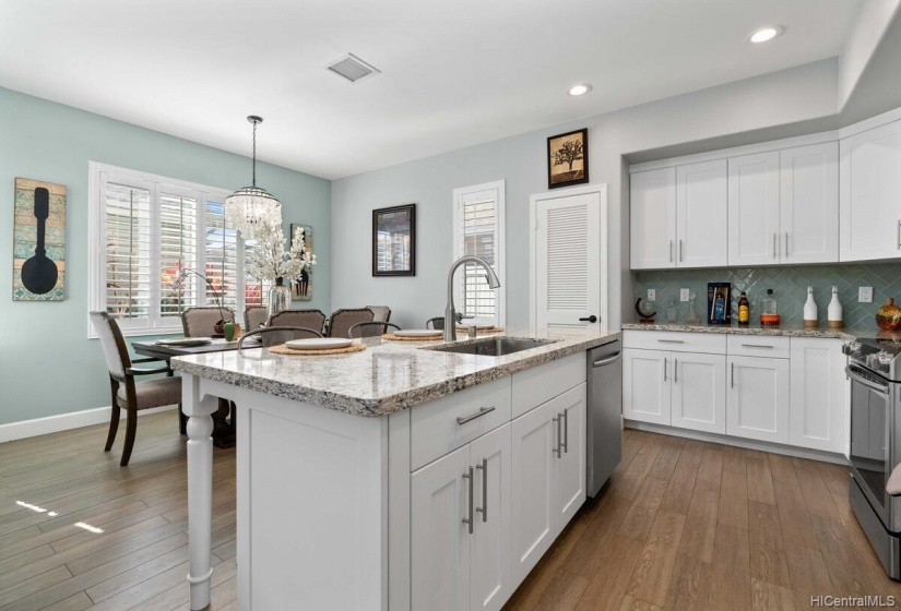 Another view of the kitchen and dining area