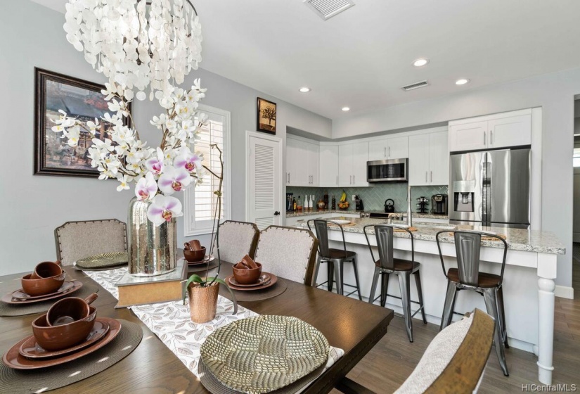 A closer picture of the dining area. Chandelier stays.