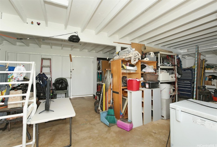 Outside covered lanai area storage and workshop.