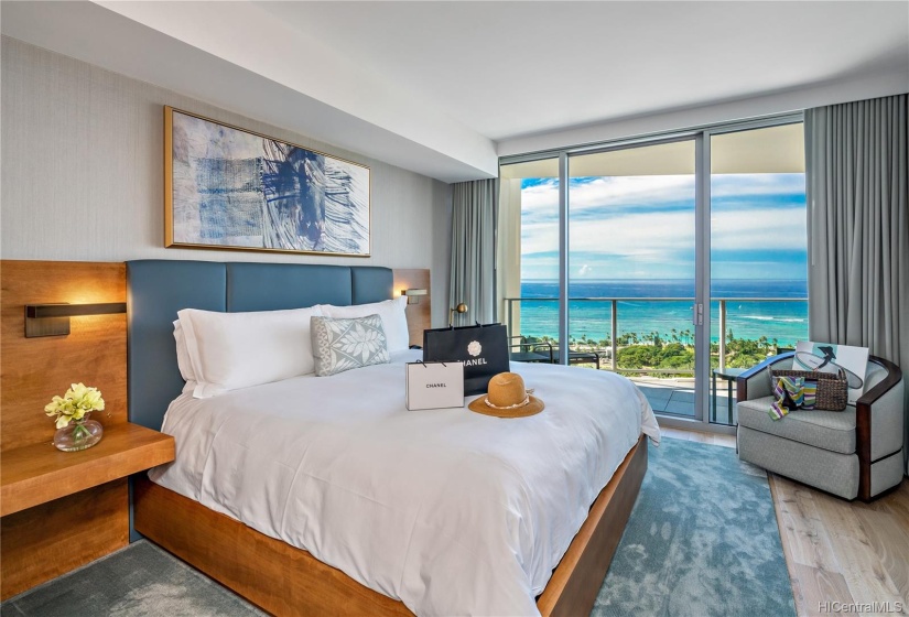 Spacious Master bedroom with gorgeous Waikiki Ocean Views and access to lanai for fresh Hawaiian breeze. Master bedroom has 2 closets (1 walk-in1), perfect for primary residence.