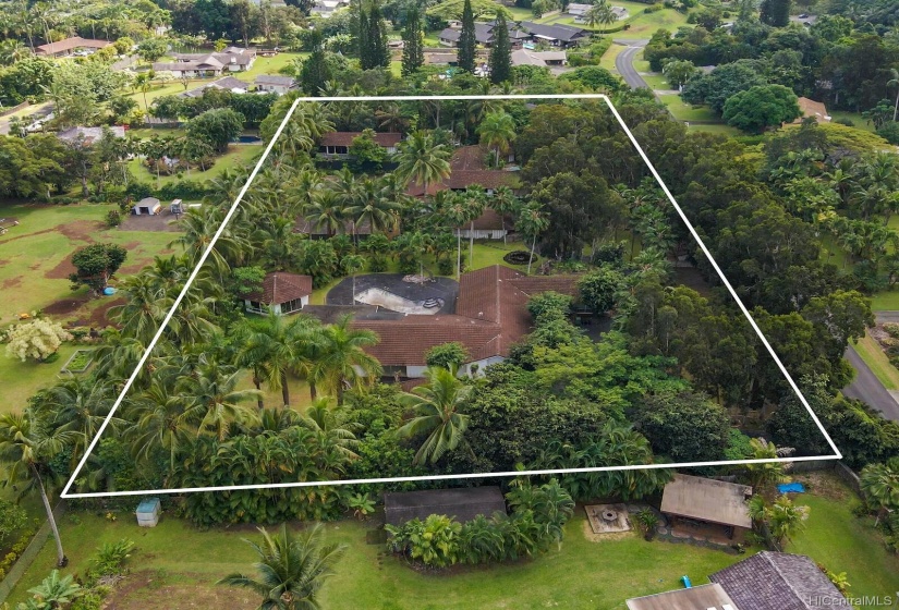 2 acres of almost level land with two homes, two pools, a tennis court and more. Ready to be brought back to life.