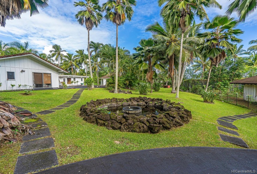 Lawa Rock Fountain and pool in the background. Haiku Plantations Hawaii