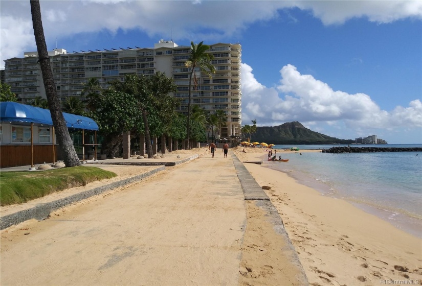 Waikiki Beach project is partially cantilevered over Waikiki Beach and has 50 linear feet Waikiki Beach frontage.  AOAO owned rooftop mounted solar hot water panels visible.