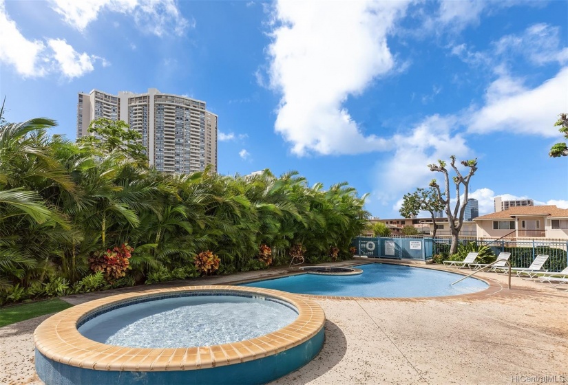 Kiddie pool in the 1st image, with swimming pool and hot tub. Well-landscaped grounds.