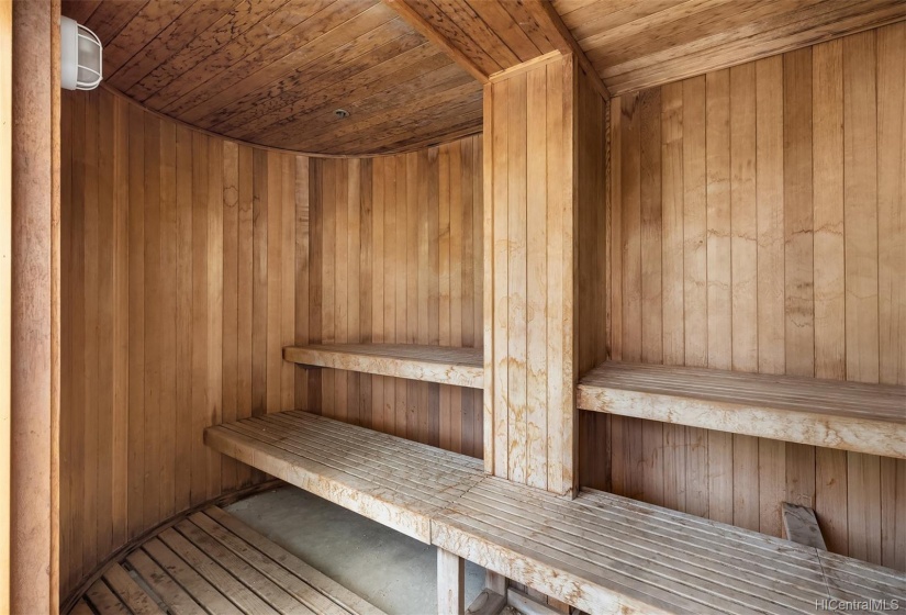 Sauna is located near the swimming pool.