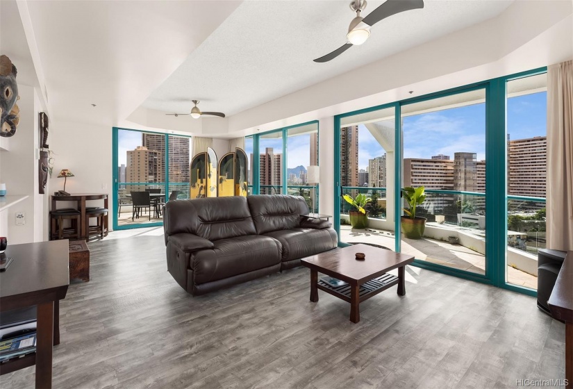 Penthouse living room with 3 separate lanais. Partial View of Diamond Head.