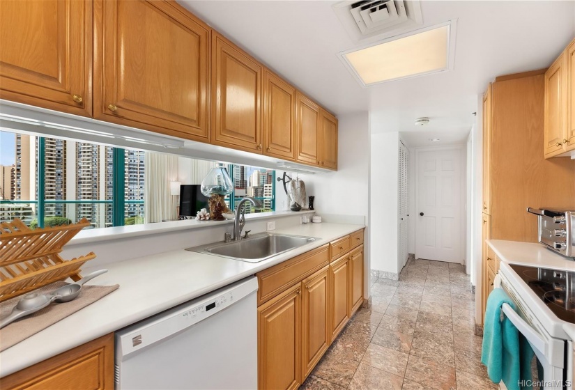 Large spacious kitchen in the Penthouse over looking Waikiki. Bedrooms located on separate ends of the Penthouse.