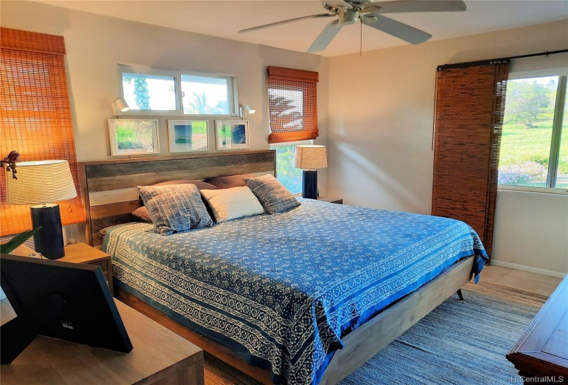 Master suite overlooks the back yard & has a sliding door to the covered lanai.