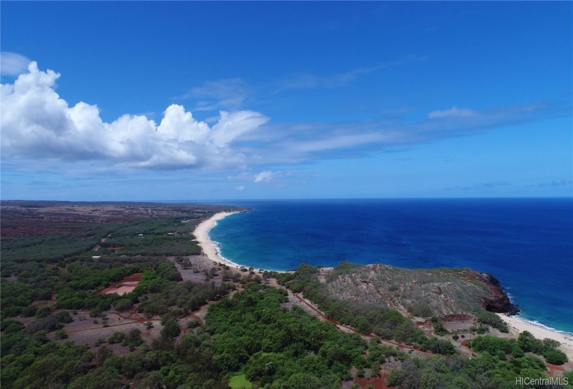 Nearby Papohaku beach & the legendary Kaiaka Rock to the right.  The beginning of Kepuhi Beach is in the far right