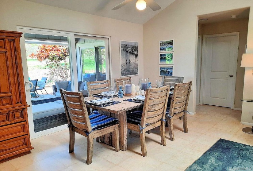 Dining area looks out to the private back yard and open area of the (closed) golf course.