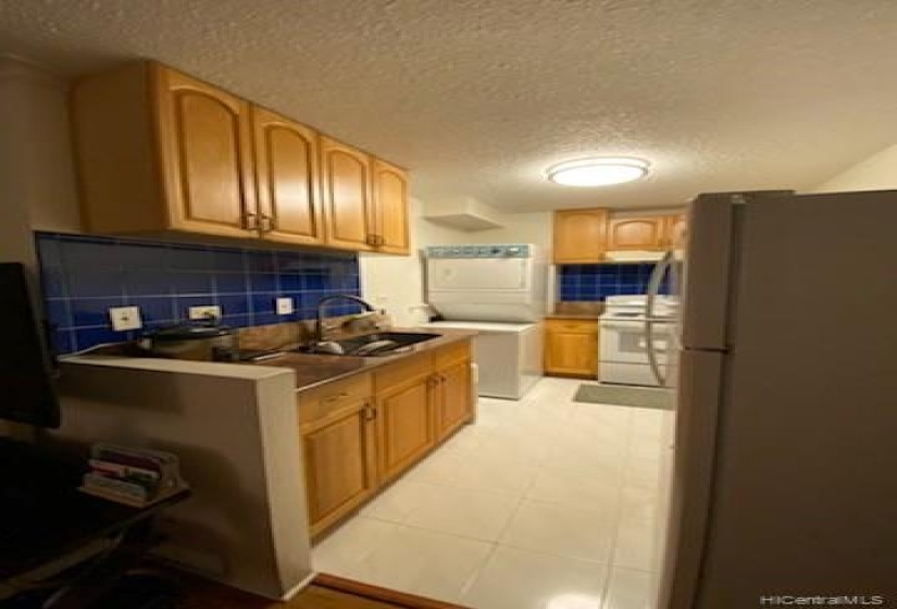 Another view of the kitchen with ceramic tile flooring