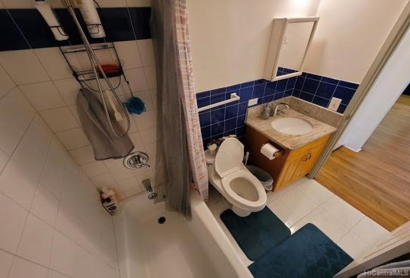 Full size bathroom with ceramic tile flooring