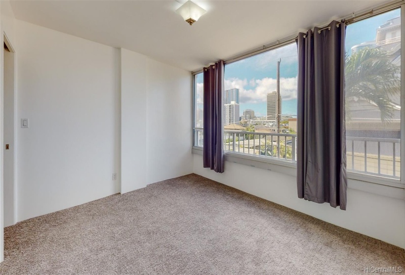 Another look at the bedroom and city view from a different angle.