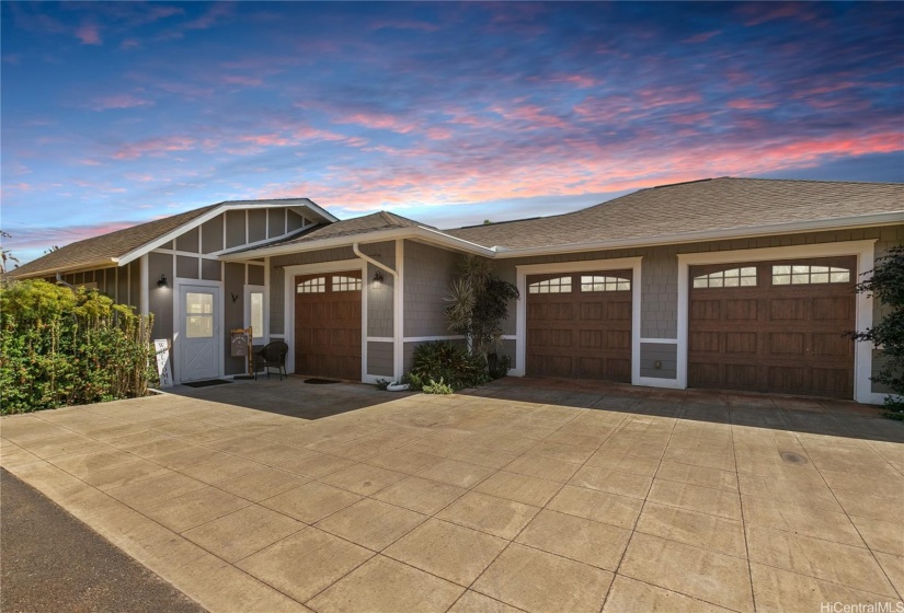 Beautiful entrance and 3 separate garage spaces.