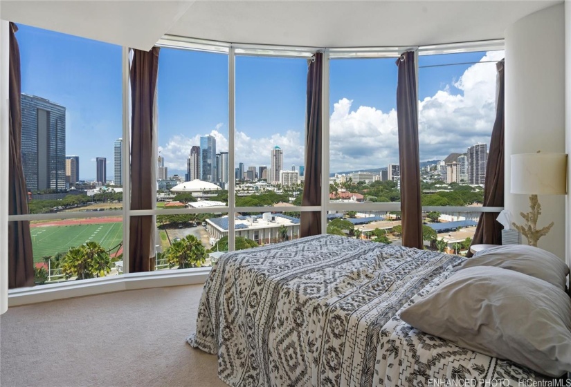 Enhanced. Guest suite bedroom with city views.