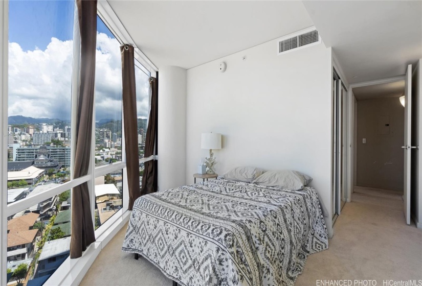 Enhanced Guest suite bedroom with city views.