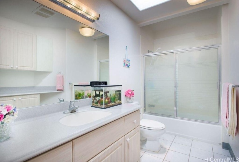 A well-lit bathroom in the main house.