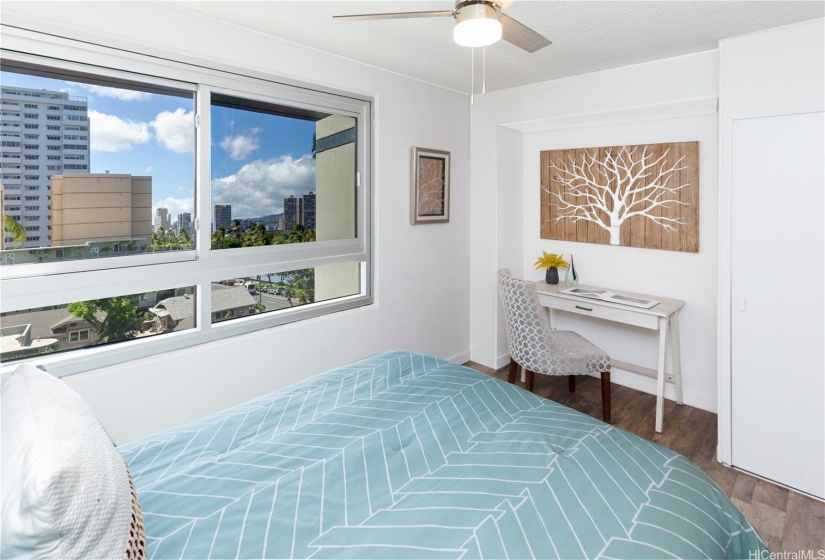 Spacious second bedroom with alcove suitable for a media center or work from home workstation.