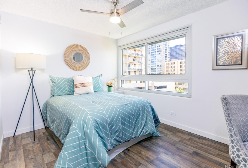 Spacious second bedroom with large closet and adjacent second bathroom.