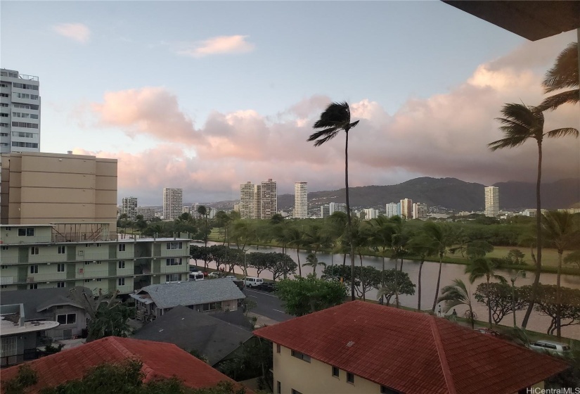 Sunset view from the living room reflected in the Ala Wai Canal.