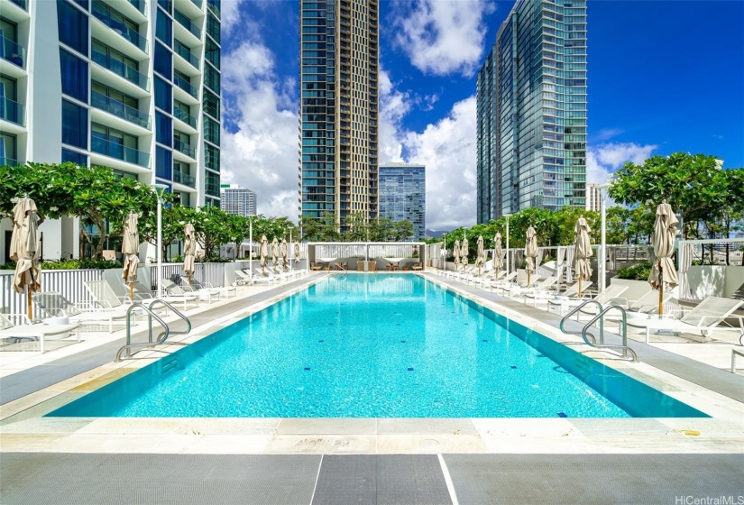 Large resort style pool with cabanas, umbrellas for shade, and 2 private bbq cabanas to enjoy.