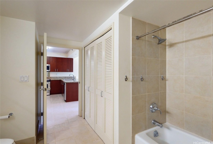 Shower/tub and bathroom.